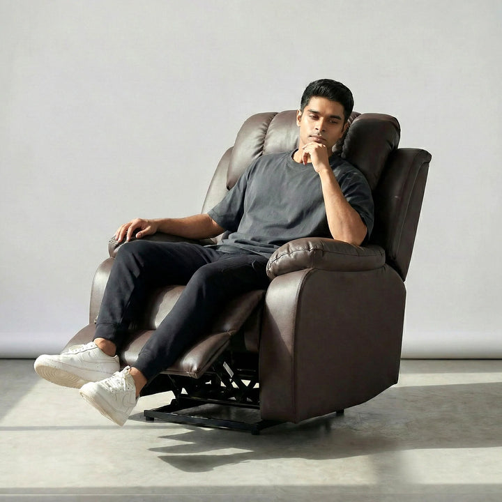 Man relaxing on Hush Hiven Big B motorized recliner chair brown leatherette single seater power recliner