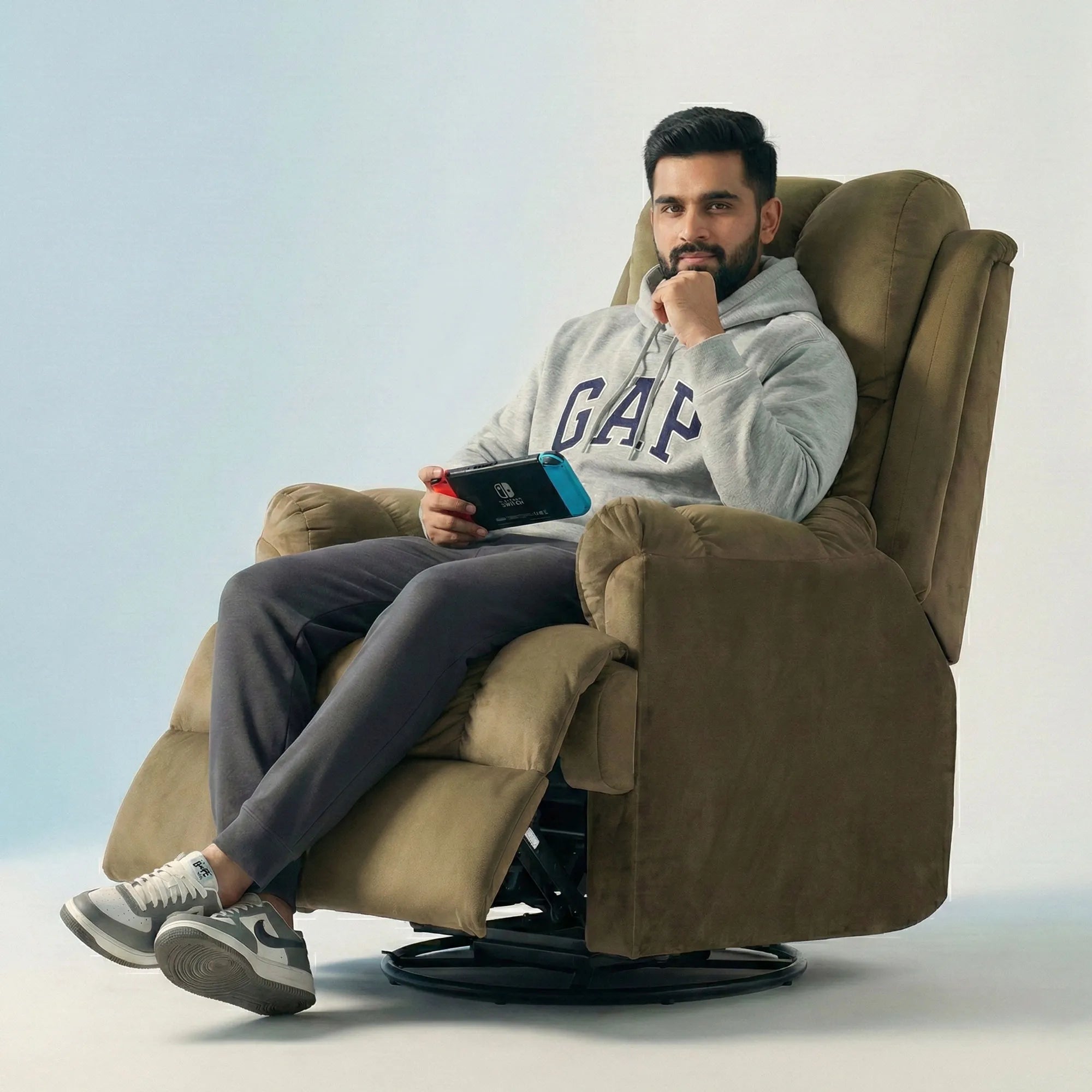 Man relaxing on Hush Hiven Donna olive brown smooth velvet motorized recliner chair dual motion luxury recliner