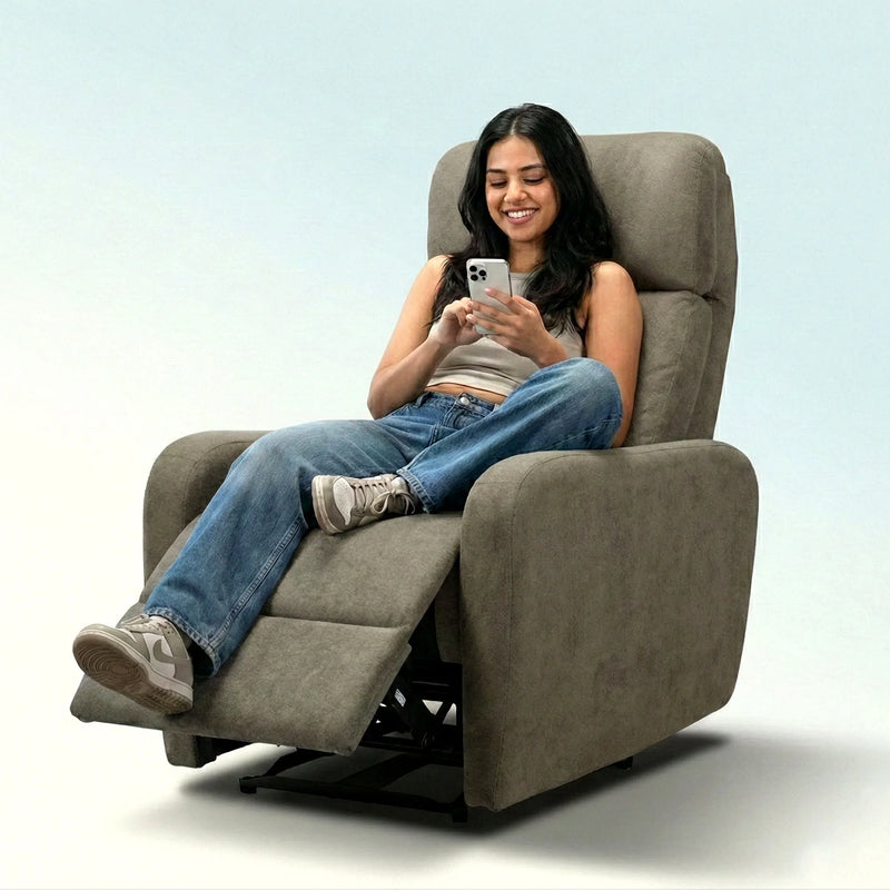 Woman using smartphone on Hush Hiven EVA manual recliner chair brown fabric single seater with footrest extended