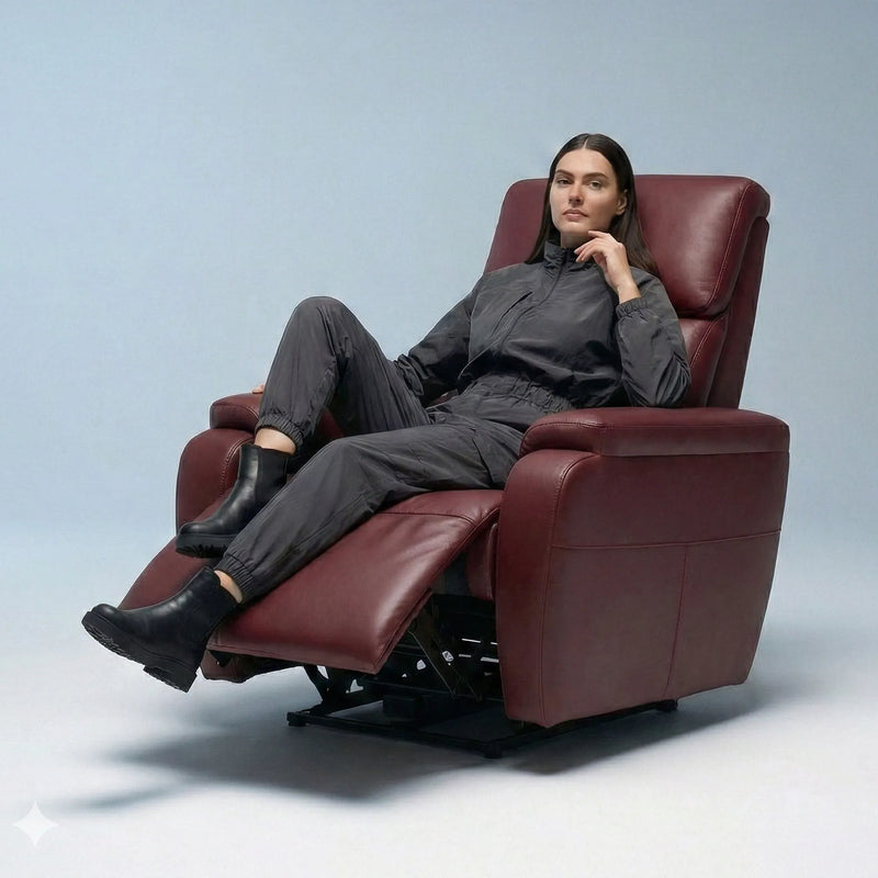 Woman relaxing on Hush Hiven Zeus maroon motorized leatherette recliner chair with extended footrest in studio setup